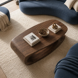Contemporary coffee table with sculptural curves and refined solid wood detailing