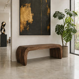 Hallway bench with smooth sculptural form and solid wood construction near a garden view