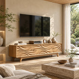 Artful entertainment unit with flowing carved fronts and practical interior storage