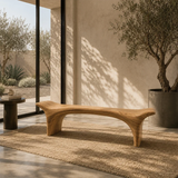 Statement bench with dramatic arched base and smooth solid wood form for upscale interiors