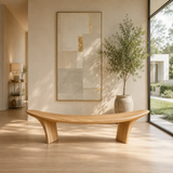 Statement bench with dramatic raised ends and solid wood form for architectural spaces