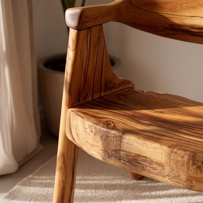 This minimalist wood chair features a rounded back and arm support for everyday comfort