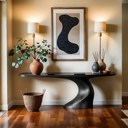 Warm entry space highlighting a sculptural wood console table with smooth texture and balance
