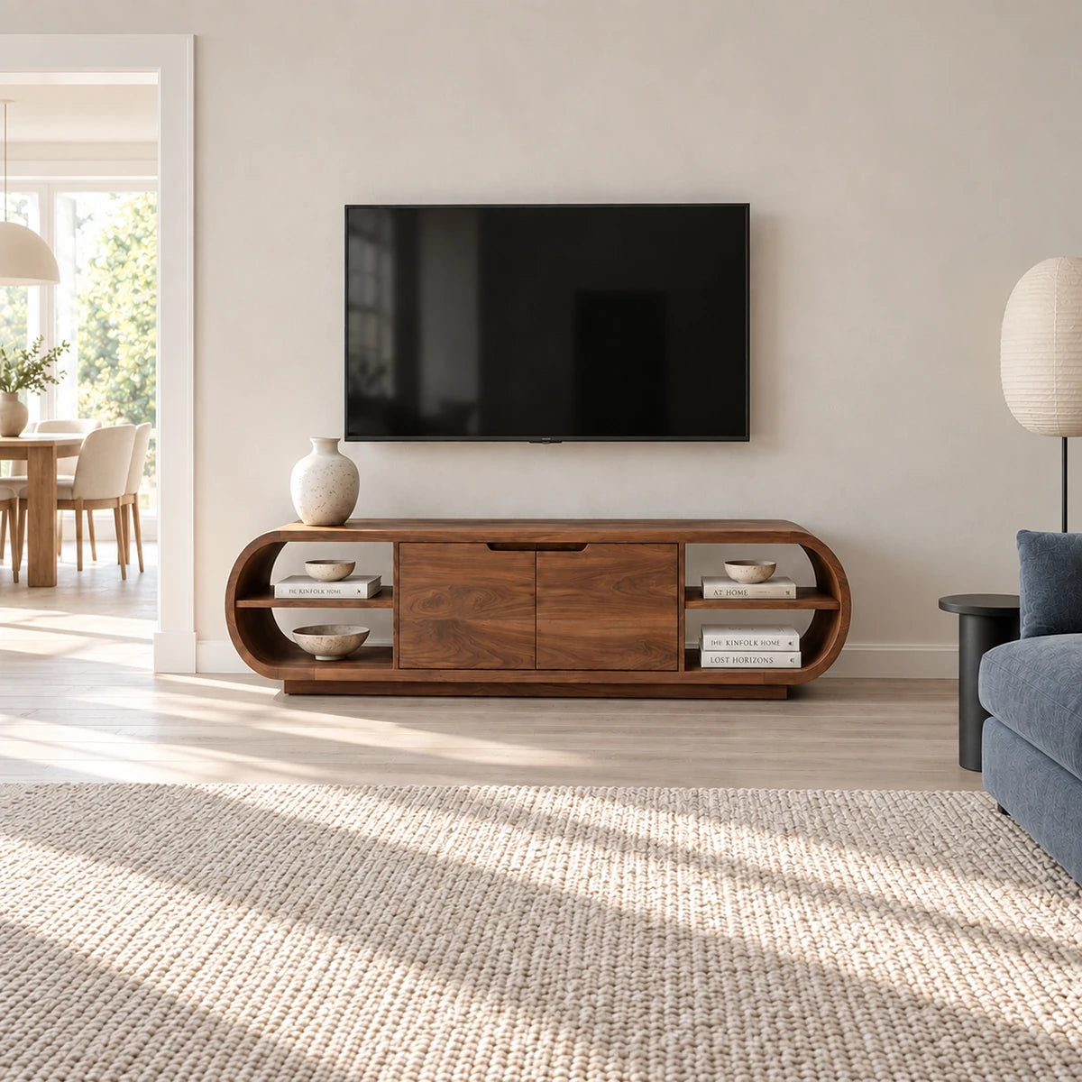 Curved media storage cabinet in solid wood with low profile and display shelving
