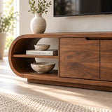 Curved TV console table in solid wood with open display shelves and center doors
