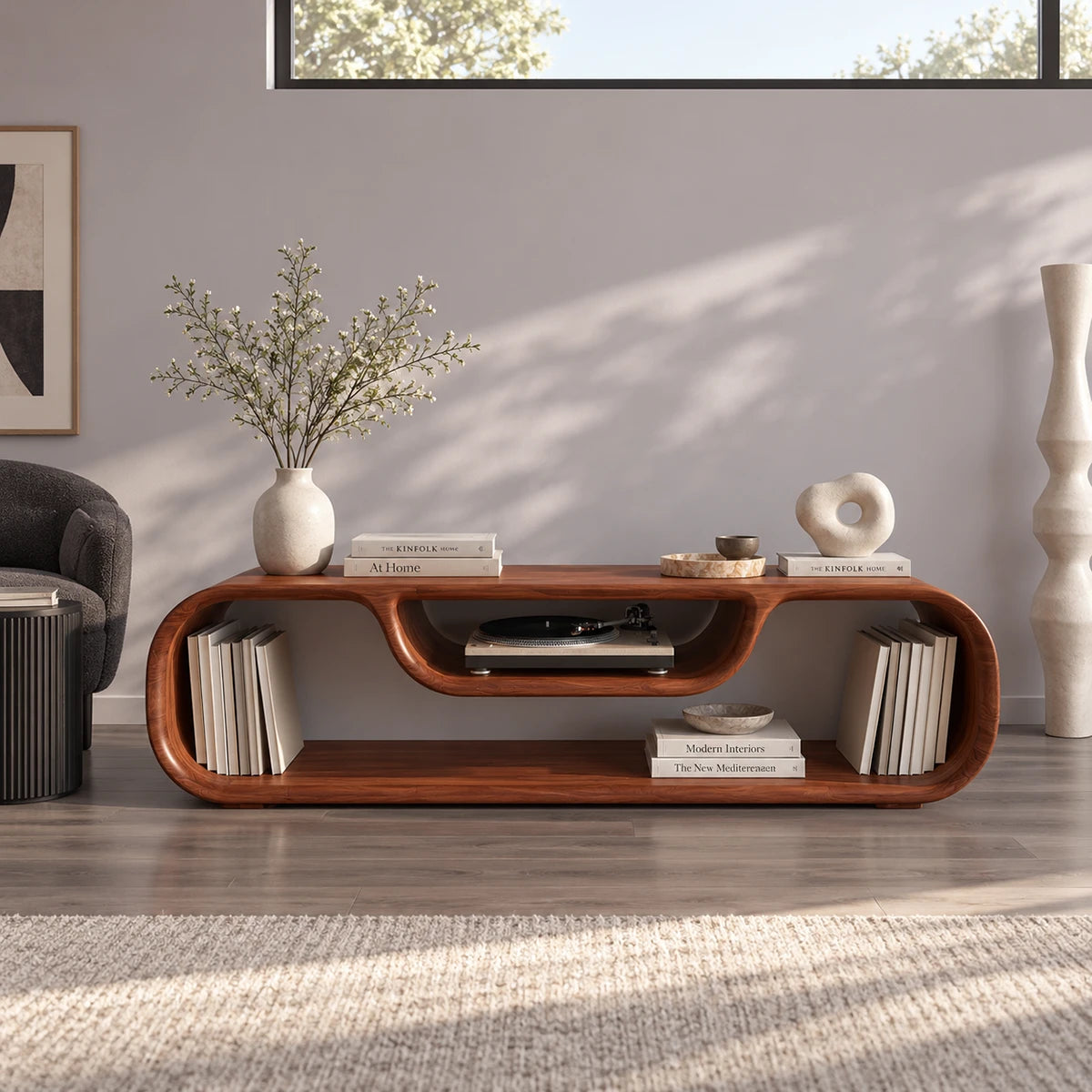 Designer media stand in solid wood with flowing edges and a recessed center compartment
