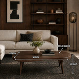 Organic shape coffee table with rounded edges and tapered legs in a modern living space