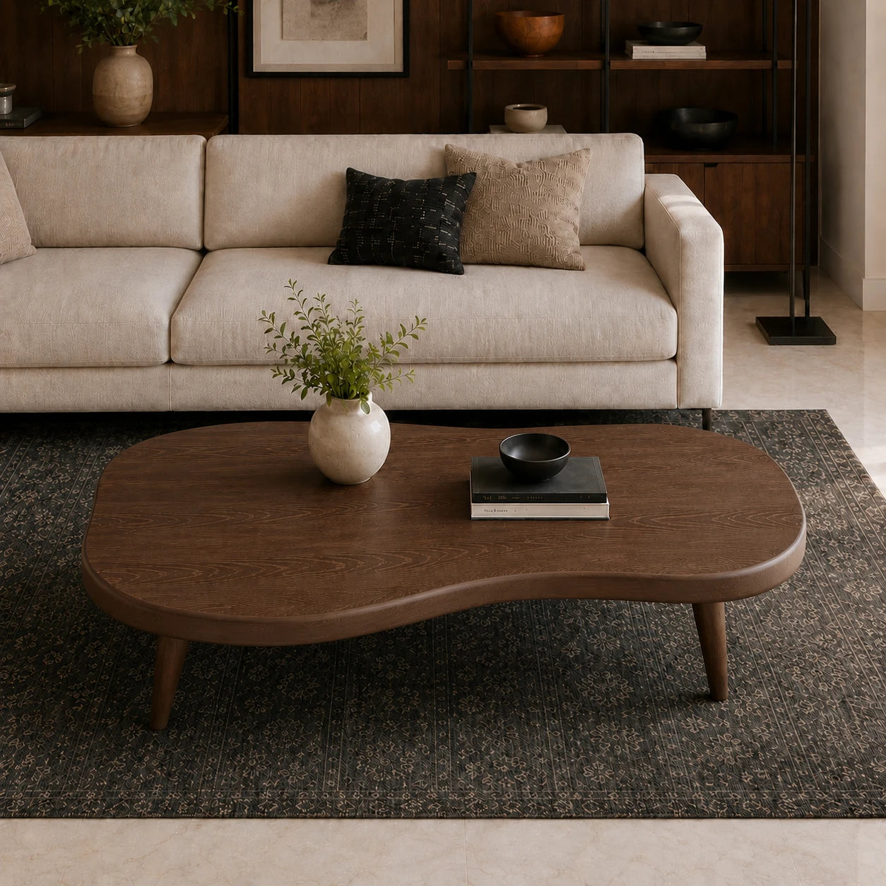 Statement coffee table with soft irregular curves and slender legs for refined interiors