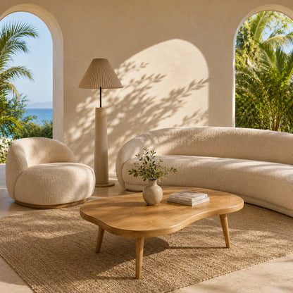Designer coffee table with rounded organic form and rich solid wood texture for lounges