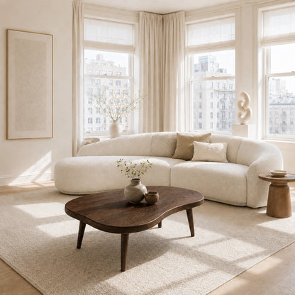 Elegant coffee table with a sculpted top and solid wood construction for stylish homes