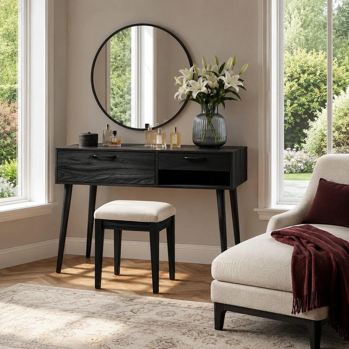 Vanity table with slim legs and organized makeup storage beside a soft padded stool