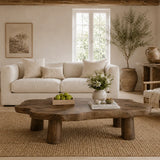 Premium coffee table with natural edge detailing and sturdy legs for a warm modern lounge