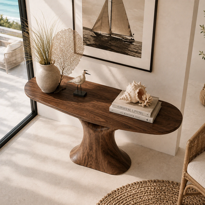 Narrow console table with an artistic base for refined coastal foyer decor styling