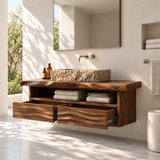 Elegant floating vanity in natural solid wood with stone vessel sink and towel storage