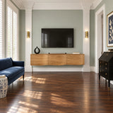 Floating entertainment console in solid wood with smooth curves and a clean facade
