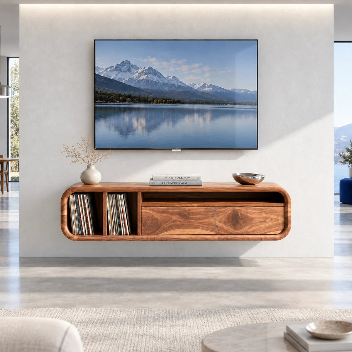 Refined wall mounted media unit in solid wood with shelving and drawer storage below
