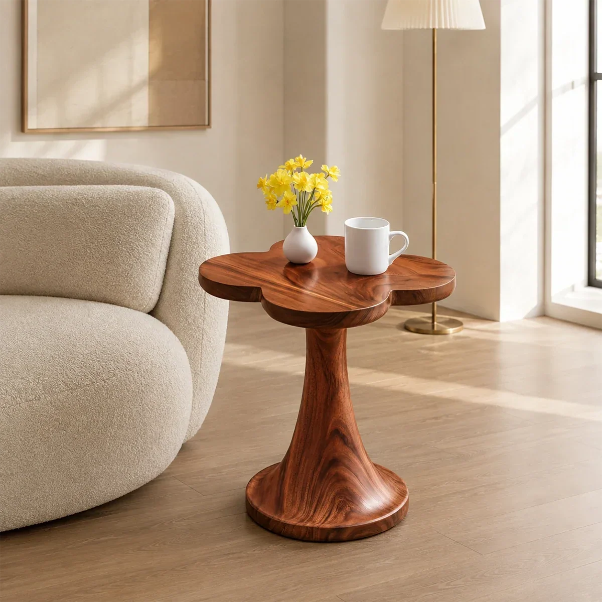 Sculptural end table with petal top and warm wood tone finish in a bright interior