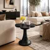 Luxury side table with rounded organic top and pedestal base in an airy interior