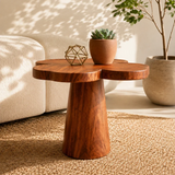 Designer side table with soft organic edges and visible grain in a refined living interior