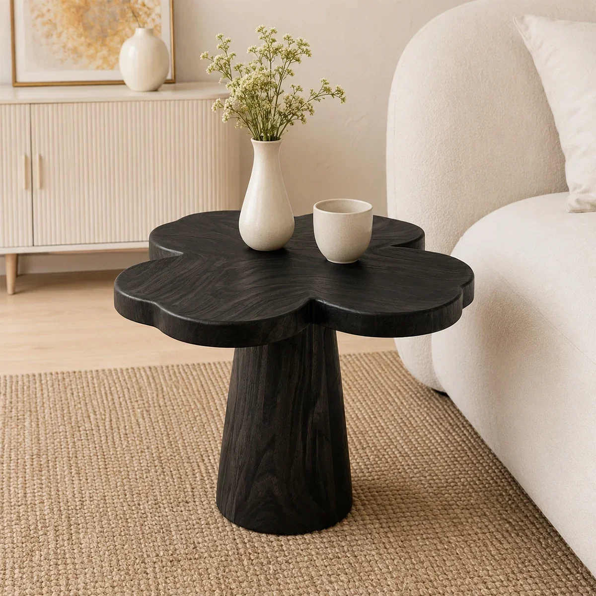 Statement end table with clover inspired top and rich wood tone in a minimalist setting
