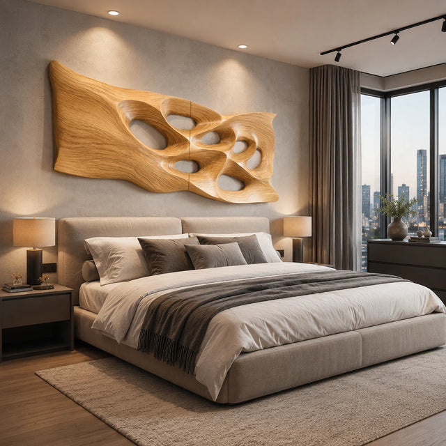 Abstract wall art with sculpted openings creates a bold focal point above a modern bed