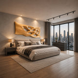 Large wall sculpture with flowing cutouts adds depth and movement to a refined bedroom