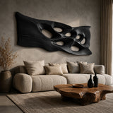 Decorative wall sculpture with sculpted voids adds movement to a bright modern bedroom