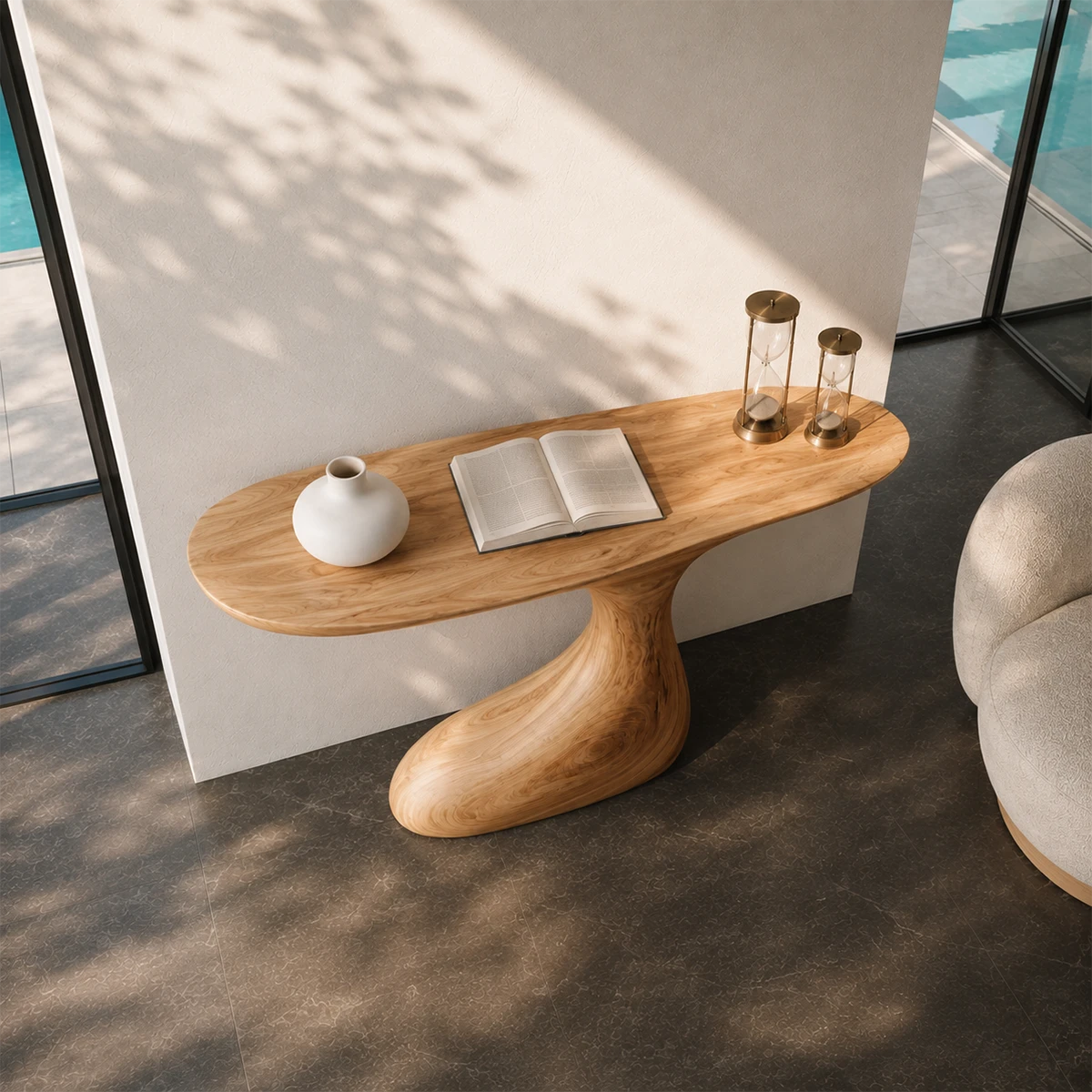 Narrow console table with an asymmetrical pedestal form for refined foyer styling