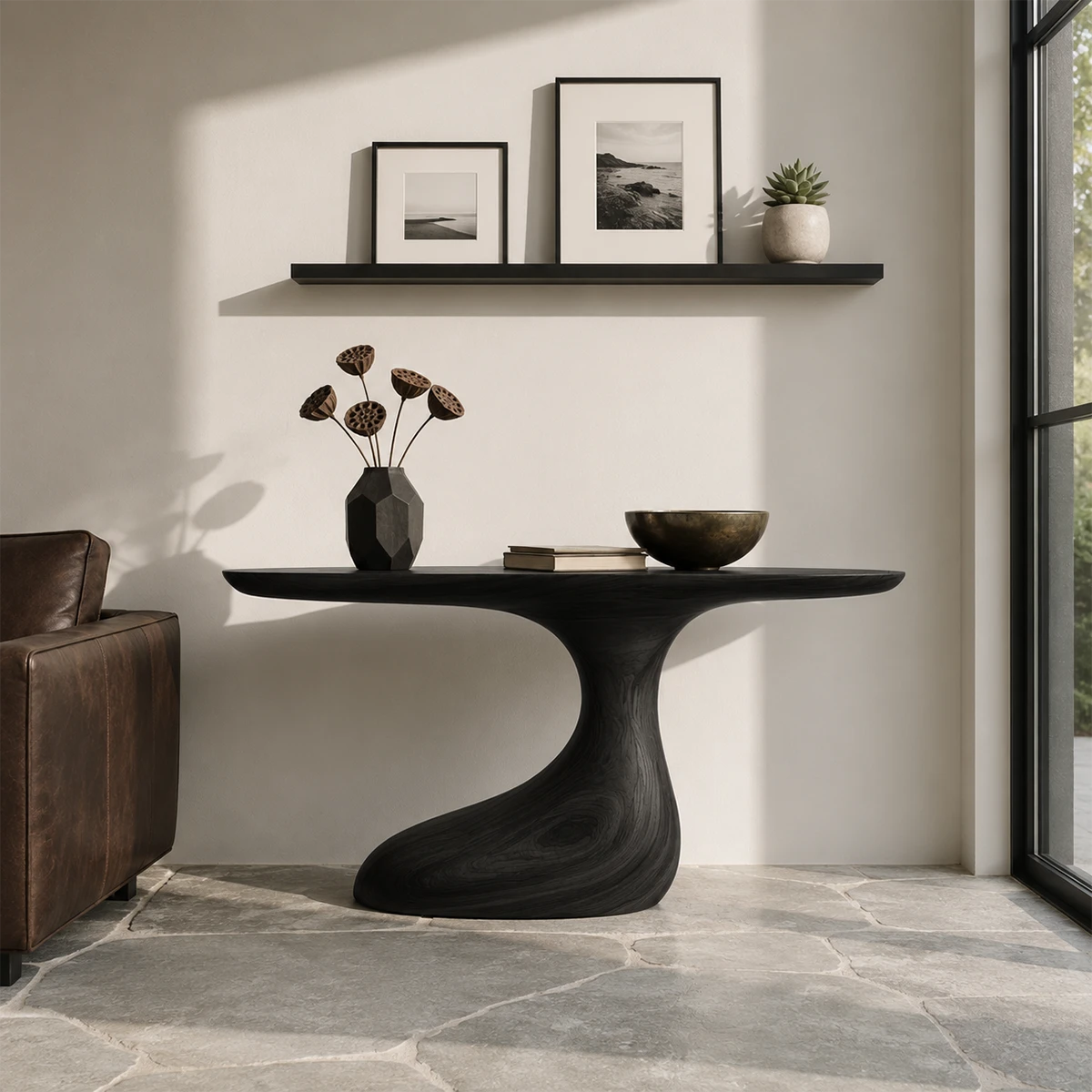Curved console table displayed with minimal decor in a bright contemporary home interior