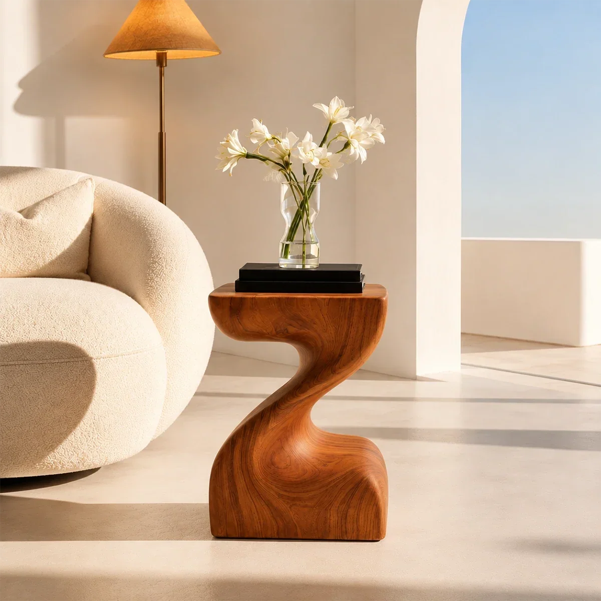 Accent end table featuring a smooth S curve base and compact top for modern styling