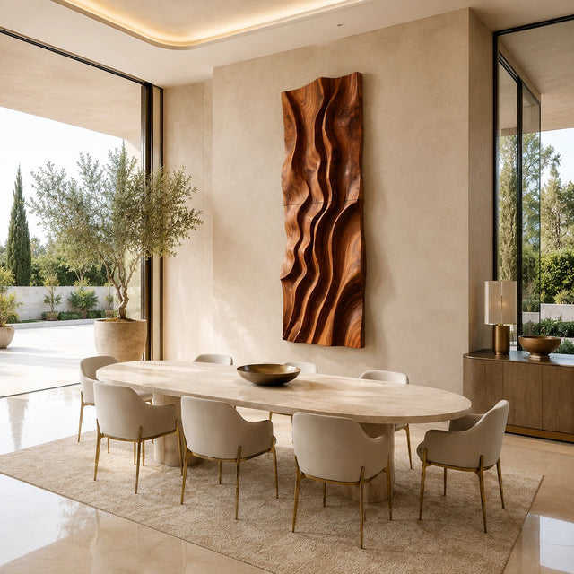Flowing carved wall art creates vertical movement and depth in a refined dining space