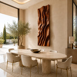 A tall relief wall sculpture with layered curves brings dimension to an elegant room