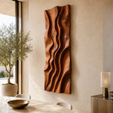 Deep carved channels give this abstract wall art a bold architectural presence indoors