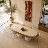 Suspended above the dining area, this wall decor introduces texture and visual movement