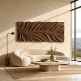 Mounted above seating, this carved wall decor introduces dimension to a bright interior