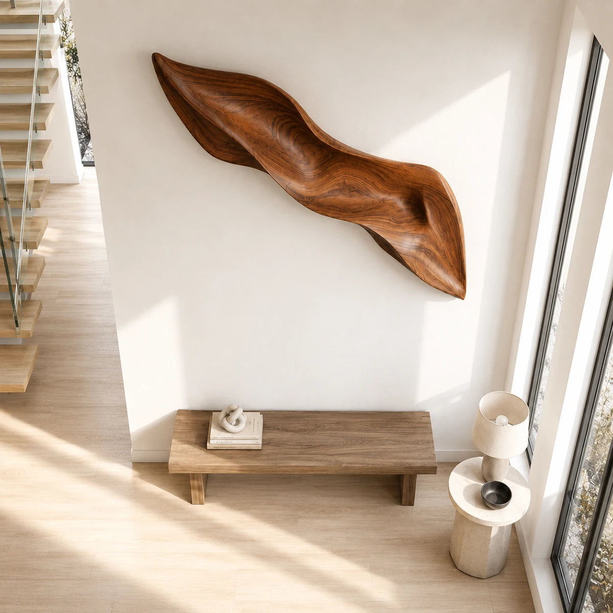 Designed with elongated curves, this wall sculpture adds visual rhythm to a modern hallway