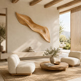 An expressive wall sculpture with fluid contours brings balance to a refined interior