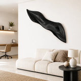 Large modern wall art with fluid curves creates a distinctive feature on a tall wall