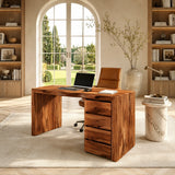 Executive desk with four drawer storage and broad worktop in a bright home office