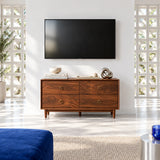 Minimalist TV storage unit in solid wood with brass ring pulls and tapered wood legs
