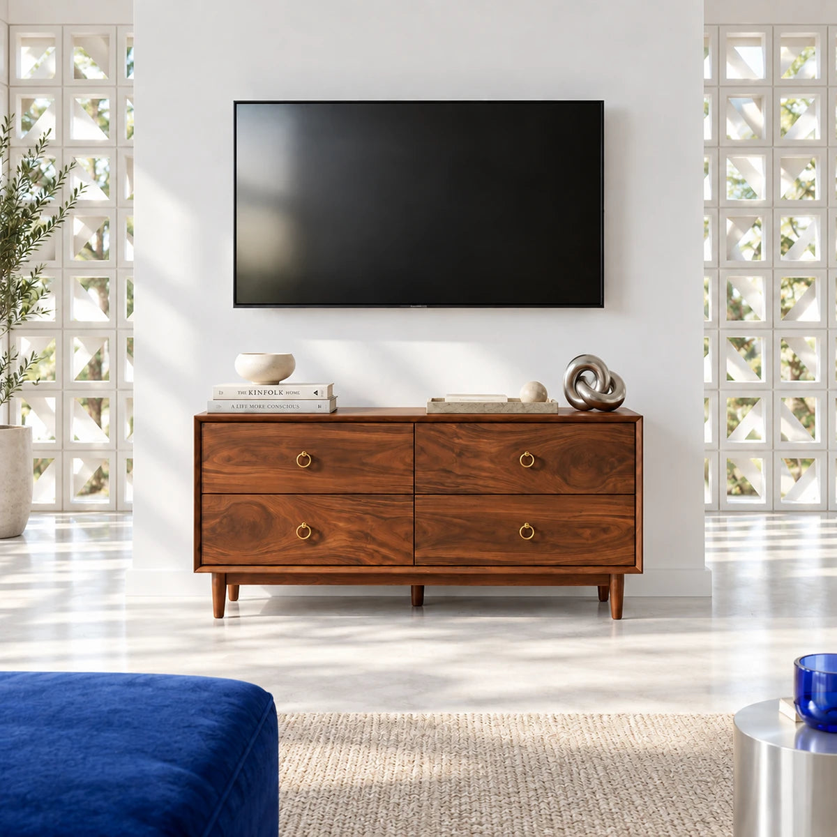 Sleek media chest in solid wood with four drawers and warm modern styling touches
