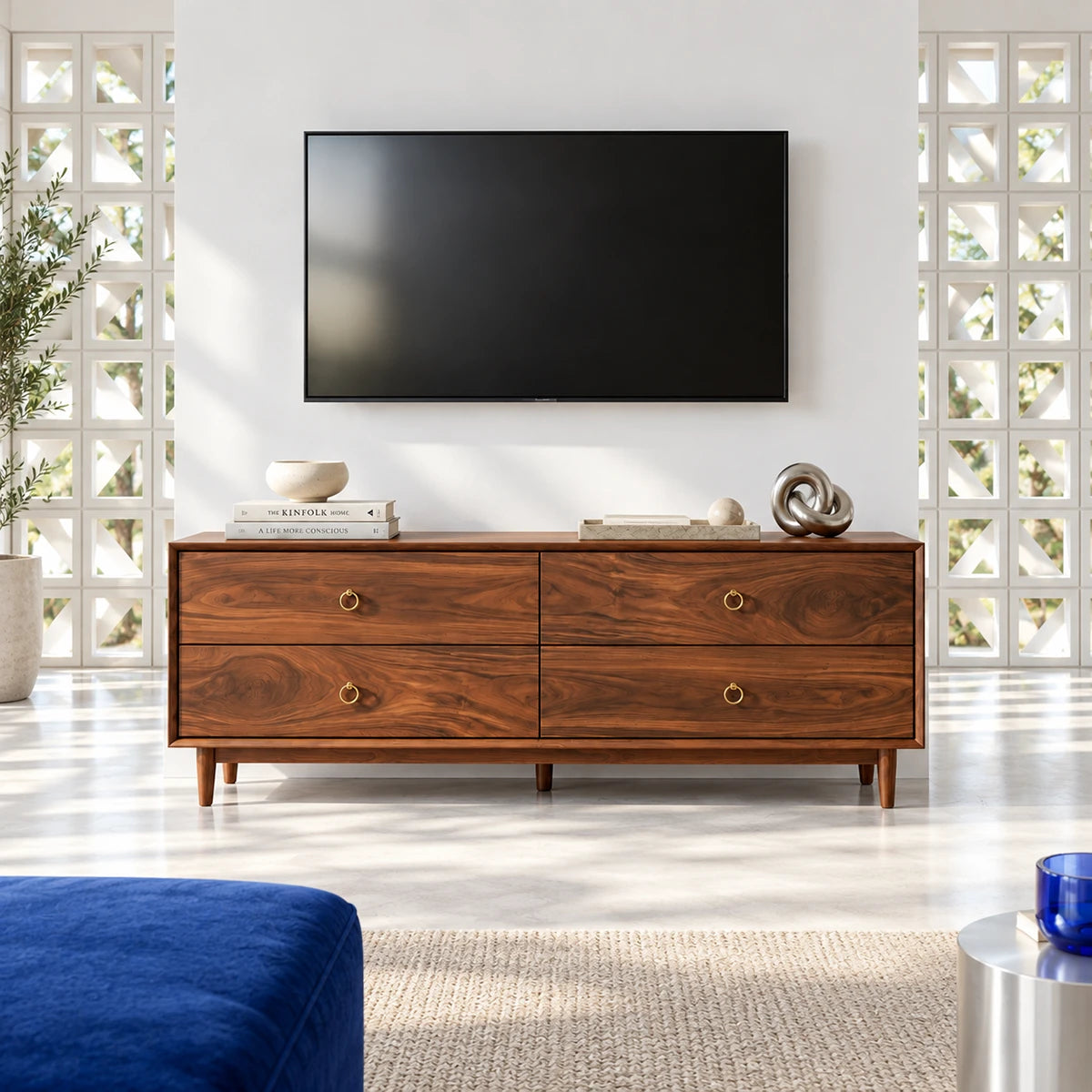 Low profile entertainment center in solid wood with spacious drawers and brass rings
