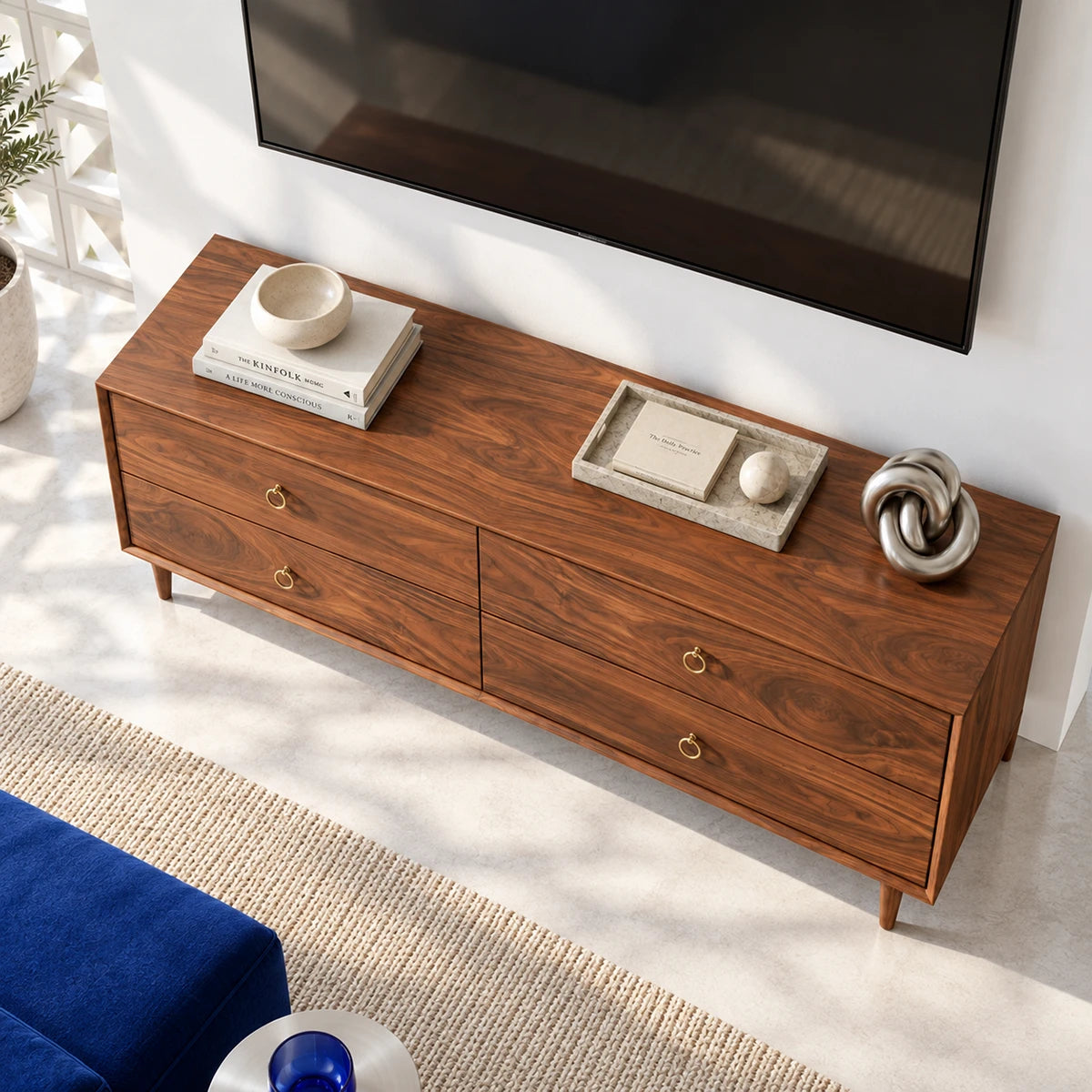 Contemporary entertainment stand in solid wood with drawer storage and ring pull accents
