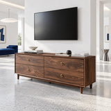 Four drawer TV cabinet in solid wood with tapered feet and brass ring pulls detail
