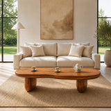 Curved coffee table with an oversized top and sturdy base in an elegant home setting