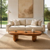 Modern coffee table featuring a flowing shape and low profile in a cozy interior