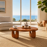Minimalist coffee table with smooth freeform shape for elegant coastal living spaces