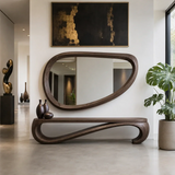 Statement bench with dramatic flowing silhouette and open base for contemporary interiors