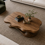 Designer coffee table with fluid silhouette and handcrafted solid wood base for lounges