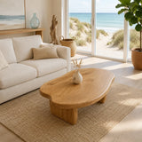 Statement coffee table with freeform top and bold solid wood supports for modern interiors